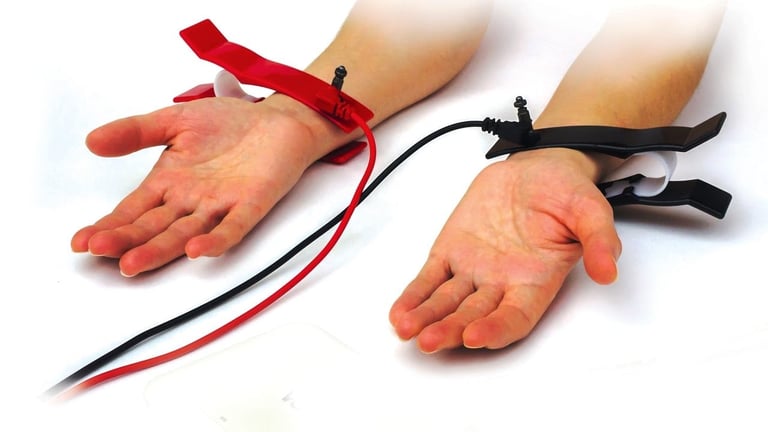 Two hands with red and black ribbon streamers extending from wrists, demonstrating a hand decoration technique